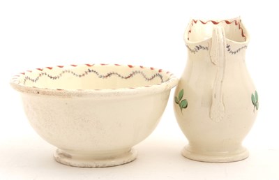 Lot 23 - A late 18th Century cream ware jug and bowl,...