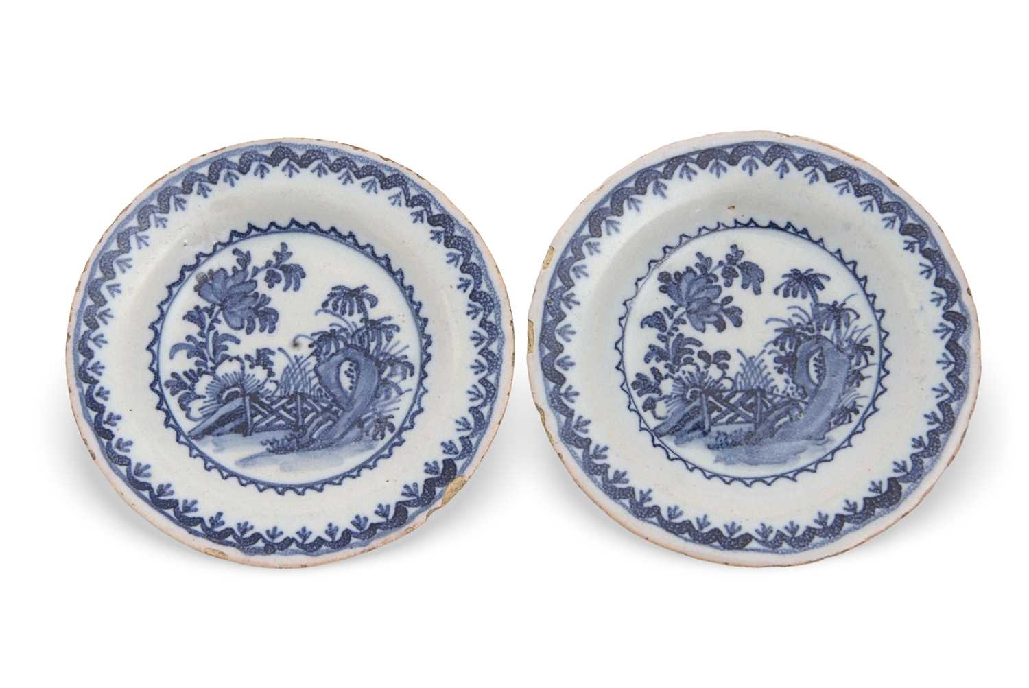 Lot 34 - An unusual pair of Delft miniature plates, the...