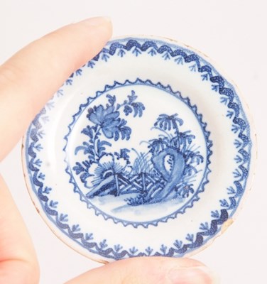 Lot 34 - An unusual pair of Delft miniature plates, the...