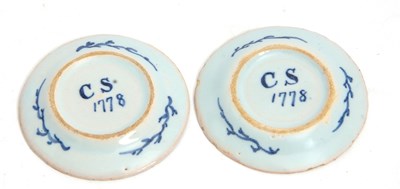Lot 34 - An unusual pair of Delft miniature plates, the...
