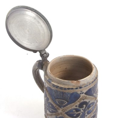 Lot 38 - A German pottery tankard or stein Westerwald...