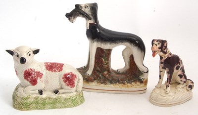Lot 48 - A Staffordshire model of a greyhound with...
