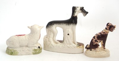 Lot 48 - A Staffordshire model of a greyhound with...