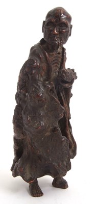 Lot 62 - A Chinese carved root wood figure, possibly...