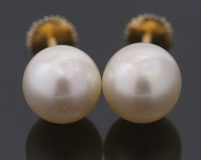 Lot 432 - A pair of 'pearl' studs, cased by Asprey, the...