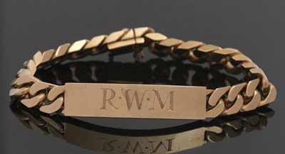 Lot 439 - A 14ct gold bracelet, with central initalled...