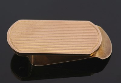 Lot 442 - A 9ct gold money clip, of oval form with...