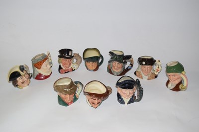 Lot 349 - A collection of small character jugs including...