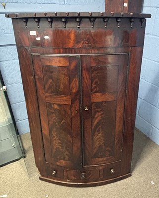 Lot 398 - A late Georgian mahogany bow front corner...