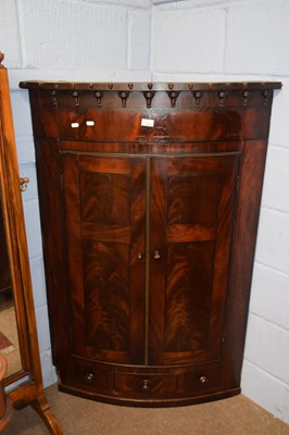 Lot 452 - A late Georgian mahogany bow front corner...