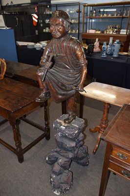 Lot 437 - A Chinese lacquered wood figure of a cobbler...