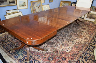 Lot 380 - Large George III mahogany extending dining...