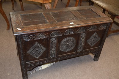 Lot 411 - An 18th Century and later carved oak coffer...