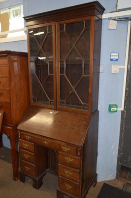 Lot 384 - A Georgian mahogany bureau bookcase, the top...