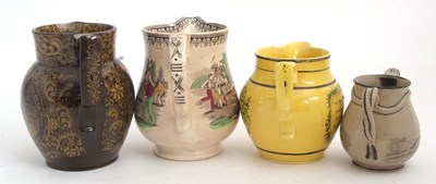 Lot 70 - Four 19th Century Staffordshire pottery jugs...