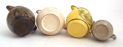 Lot 70 - Four 19th Century Staffordshire pottery jugs...