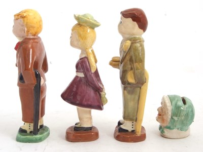 Lot 72 - A late 19th Century child's money box modelled...