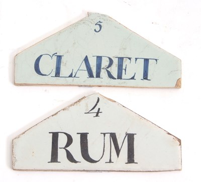 Lot 75 - Two wine/spirit labels with Delft type glaze,...