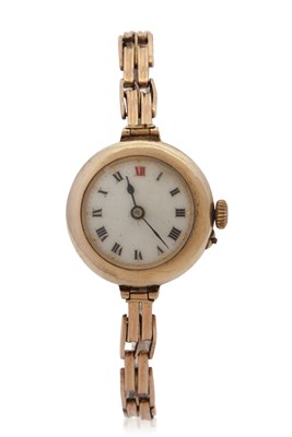 Lot 357 - A 9ct gold cased ladies watch on a yellow...