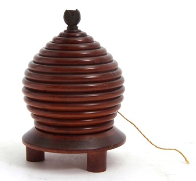 Lot 82 - A 19th Century treen lignum vitae beehive...