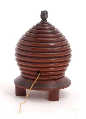 Lot 82 - A 19th Century treen lignum vitae beehive...