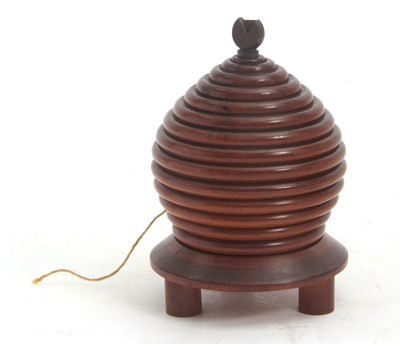 Lot 82 - A 19th Century treen lignum vitae beehive...