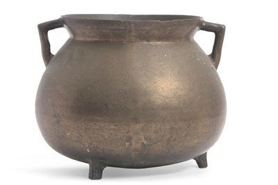 Lot 105 - A large antique bronze cauldron having twin...