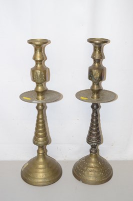 Lot 146 - A pair of Indian brass candlesticks