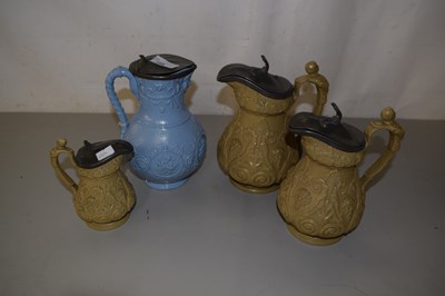 Lot 168 - A group of four Victorian pewter lidded relief...