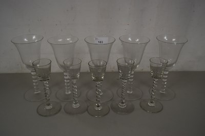 Lot 183 - A set of five clear spirit glasses with...