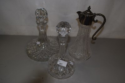 Lot 207 - A claret jug and two decanters