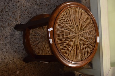 Lot 289 - A wicker and hardwood two tier lamp table