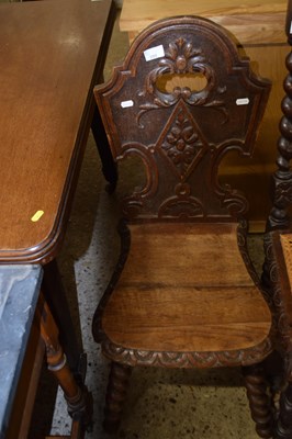 Lot 299 - A Victorian oak hall chair with carved detail