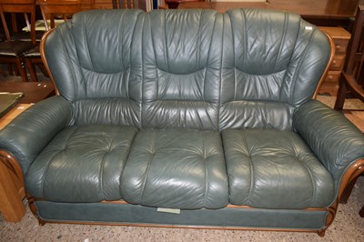 Lot 305 - Green leather three seater sofa