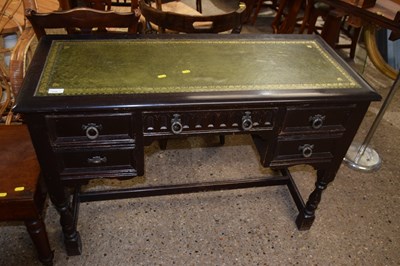 Lot 316 - 20th Century dark oak desk with green leather top