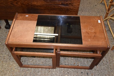 Lot 319 - A nest of three retro teak coffee tables (one...