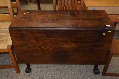 Lot 320 - A Georgian mahogany drop leaf dining table