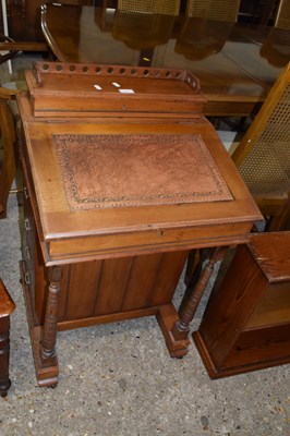 Lot 343 - An late Victorian walnut framed Davenport desk