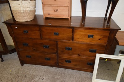 Lot 370 - Modern dark wood seven drawer chest with metal...