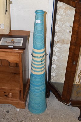 Lot 373 - A large floor standing ribbed vase decorated...