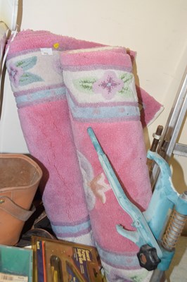 Lot 713 - Two pink patterned rugs