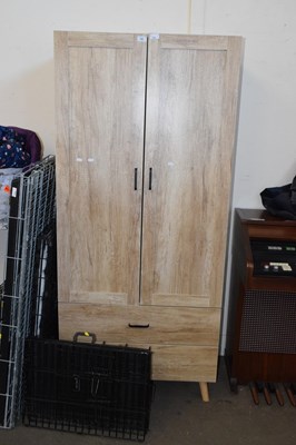 Lot 726 - A light wood effect wardrobe