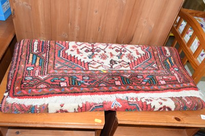 Lot 778 - A small 20th Century red patterned floor rug