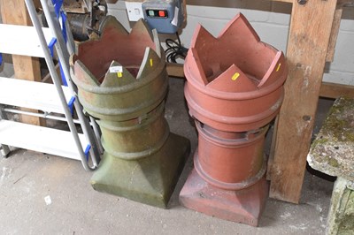 Lot 848 - A pair of terracotta castle top chimney pots...