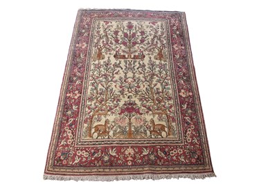 Lot 486 - An Iranian Isfahan rug decorated with a large...