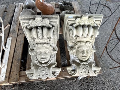 Lot 301A - Two concrete wall hanging planters depicting...