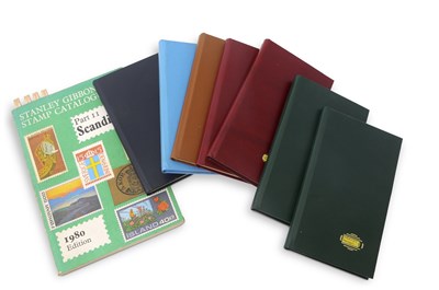 Lot 275 - A collection of seven small stamp albums...