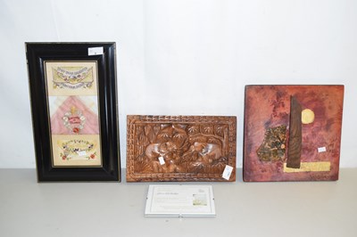 Lot 9 - A framed piece of material which includes two...