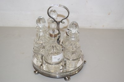 Lot 51 - A plated condiment set with vinegar bottles...