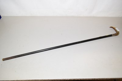 Lot 82 - A walking stick with silver and horn handle